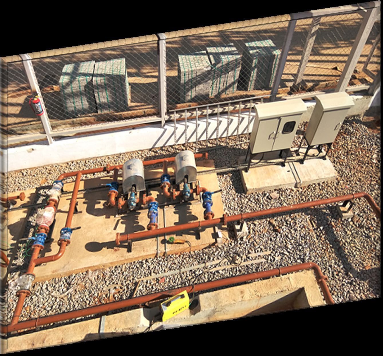 Network of fabricated process piping, valves and equipment skids installed on an industrial site