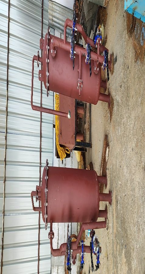 Red-painted pressure vessel with pressure gauges and valves fabricated by VSS Enterprises
